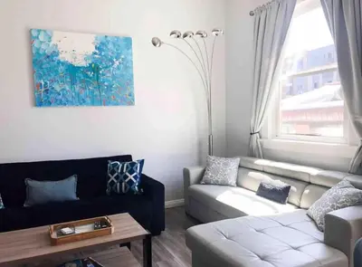 a living room with a couch and a table at Downtown SD 2BR Suite Free Parking Conv Center in San Diego