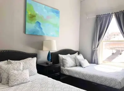 a bedroom with two beds and a window at Downtown SD 2BR Suite Free Parking Conv Center in San Diego