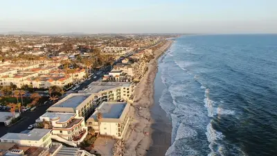 an aerial view of a beach with houses and the ocean at Oceanfront 2BR Condo, Private Beach & Patio, Rare Find in Carlsbad