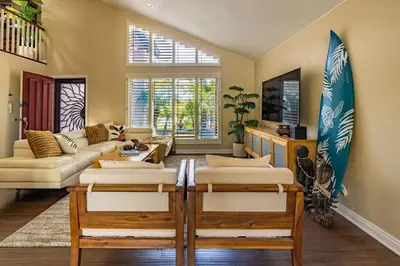 a living room with a bunch of mattresses in a room at Resort style back yard heated pool and spa in Encinitas