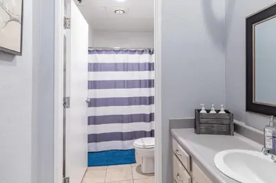 a bathroom with a toilet and a sink at Free Parking Loft Suite Walk to Conv Center in San Diego