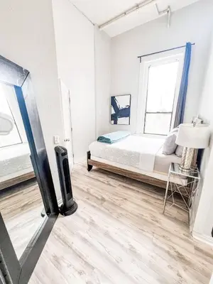 a bedroom with a bed and a tv in it at 2BR Free Parking Walk to Convention Center in San Diego