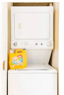 a microwave oven sitting on top of a refrigerator at Walk to Conv Center Free Parking 4 Beds in San Diego