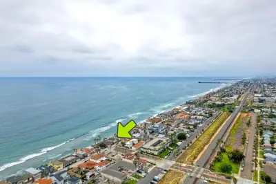 an aerial view of a city and the ocean at Oceanfront 4BR, Private Beach & Patio, Remodeled Kitchen in Oceanside