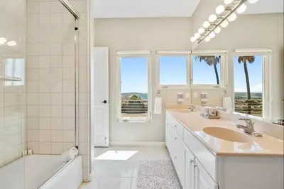 a bathroom with two sinks and a tub and a shower at California Dreamin Your Ocean-View Sanctuary in San Diego