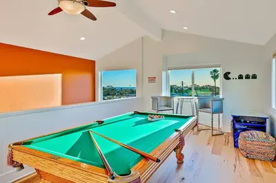 a pool table in a room with a ceiling fan at 1185 Tamarack home in Carlsbad