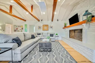 a living room with a couch and a fireplace at 1185 Tamarack home in Carlsbad