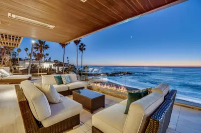 a living room with a view of the ocean at Luxury Beachfront Home with Hot Tub & Ocean Views in San Diego