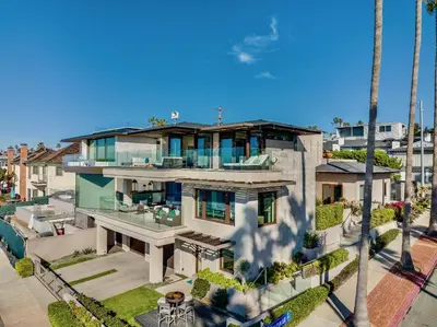 an aerial view of a house with palm trees at Luxury Beachfront Home with Hot Tub & Ocean Views in San Diego