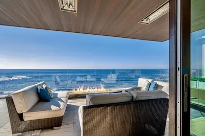 an open patio with a view of the ocean at Luxury Beachfront Home with Hot Tub & Ocean Views in San Diego