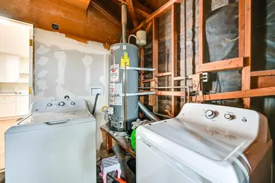 a laundry room with a washer and dryer at Pet-Friendly San Diego Studio about 14 Mi to Downtown in San Diego