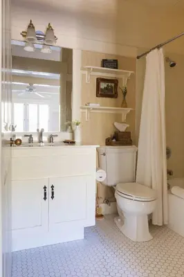 a white bathroom with a toilet and a sink at Orchard Hill in Julian