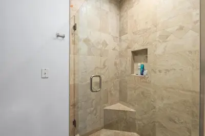 a shower with a glass door in a bathroom at 683 Just inside the gates of the Resort - Golf & Premier Fitness Guests Welcome in Encinitas