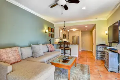 a living room with a couch and a table at 604 Gorgeous Renovated Condo, Steps to Omni Spa, Golf, Tennis, PFC & Exclusive Building Pool in Encinitas