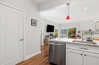 a kitchen with white cabinets and a counter top at 628 Escape to Relaxation-Free Wifi-Free Parking in Encinitas