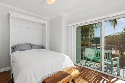 a bedroom with a bed and a large window at 628 Escape to Relaxation-Free Wifi-Free Parking in Encinitas