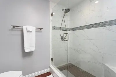 a bathroom with a glass shower with a toilet at 629 Walk to Restaurants Close to Golf and Spa Luxury Inside the gates in Encinitas