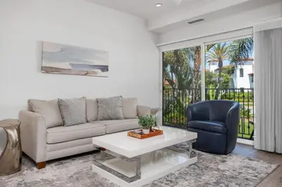 a living room with a couch and a chair at 629 Walk to Restaurants Close to Golf and Spa Luxury Inside the gates in Encinitas