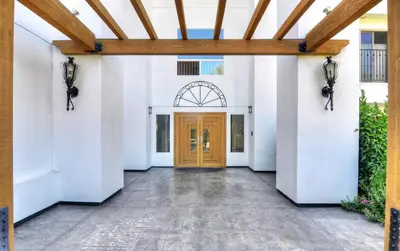 a hallway with a wooden door in a building at 647 Luxury Inside The Gates LaCosta Resort-Top Floor Steps from Resort 647 in Encinitas