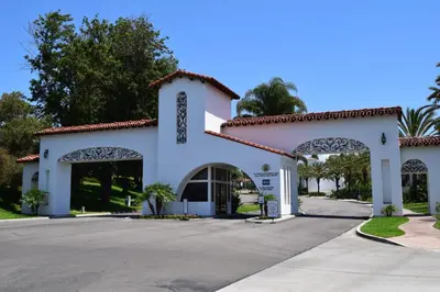 a white building with arches and trees at 647 Luxury Inside The Gates LaCosta Resort-Top Floor Steps from Resort 647 in Encinitas