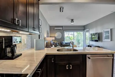 a kitchen with a sink and a counter top at 647 Luxury Inside The Gates LaCosta Resort-Top Floor Steps from Resort 647 in Encinitas