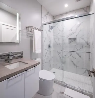 a white bathroom with a shower and a toilet at 645 Fresh Modern Condo Inside Resort Gates - Free Wifi - Walk to Spa in Encinitas