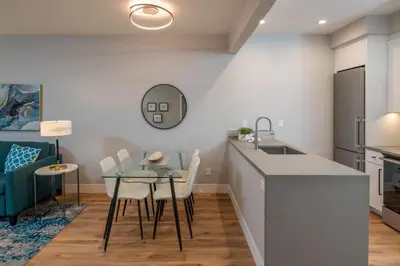 a kitchen and dining room with a table and chairs at 645 Fresh Modern Condo Inside Resort Gates - Free Wifi - Walk to Spa in Encinitas