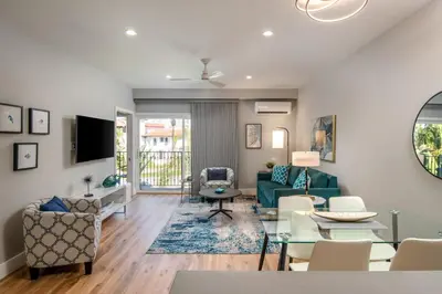 a living room with a couch and a table at 645 Fresh Modern Condo Inside Resort Gates - Free Wifi - Walk to Spa in Encinitas