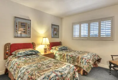 a bedroom with two beds and a window at 210A Marina Del Mar - Beach View in Oceanside
