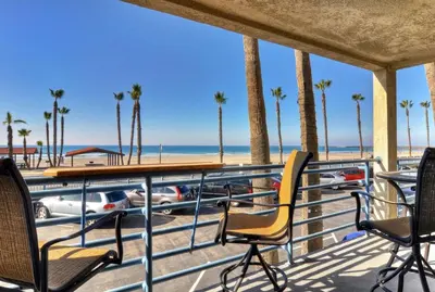 a balcony with chairs and a view of the beach at 210A Marina Del Mar - Beach View in Oceanside