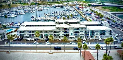 an aerial view of a marina with a large building at 211A Freshly Renovated Steps from the Sand at the Beach Oceanside in Oceanside