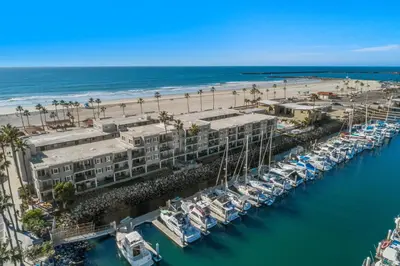an aerial view of a marina next to a beach at 211B - Harbor, Seals, Birds, Night Lights, Steps to the Sand! in Oceanside