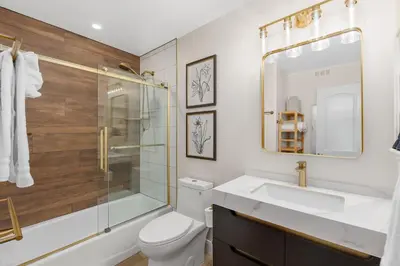 a bathroom with a toilet and a sink and a shower at 211B - Harbor, Seals, Birds, Night Lights, Steps to the Sand! in Oceanside