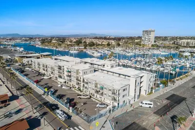 an aerial view of a marina with buildings and boats at 313B Steps from the Sand at Harbor Beach - Free Wifi in Oceanside