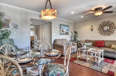 a living room with a table and a couch at 314B Harbor View, Steps to the Beach, Free Wifi, Marina Del Mar 314B in Oceanside