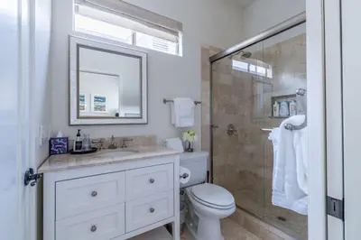 a bathroom with a toilet and a sink and a shower at Water and sunset views in dreamy Cardiff by the sea in Encinitas