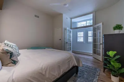 a bedroom with a large bed and a window at Water and sunset views in dreamy Cardiff by the sea in Encinitas