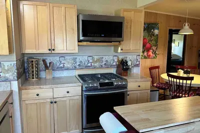 a kitchen with a stove and a microwave at Julian Orchard Ranch in Santa Ysabel