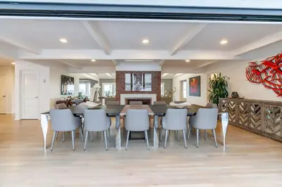 a dining room and living room with a table and chairs at Walk to Beach Stunning Views La Jolla Shores in San Diego