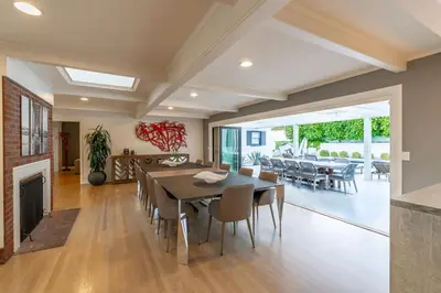 a dining room with a table and a fireplace at Walk to Beach Stunning Views La Jolla Shores in San Diego