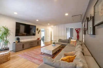 a living room with a couch and a tv at Walk to Beach Stunning Views La Jolla Shores in San Diego