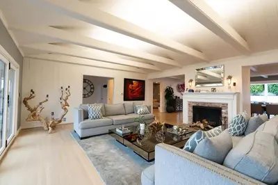 a living room with two couches and a fireplace at Walk to Beach Stunning Views La Jolla Shores in San Diego