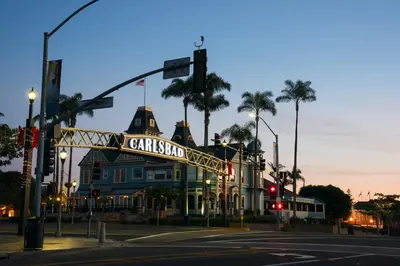 a building with a sign for a cinema on a street at Juniper Coastal Home - 30-Night Minimum in Carlsbad
