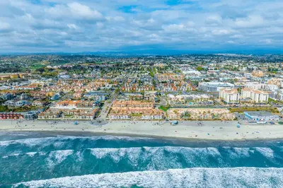 an aerial view of a beach and buildings at Seaside Serenity Retreat in Oceanside
