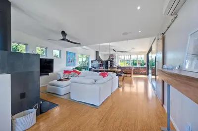 a living room with a white couch and a kitchen at Bali Hai, Luxury, High-End Encinitas Home, Large Outdoor Living Area in Encinitas