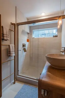 a bathroom with a glass shower and a sink at Bali Hai, Luxury, High-End Encinitas Home, Large Outdoor Living Area in Encinitas