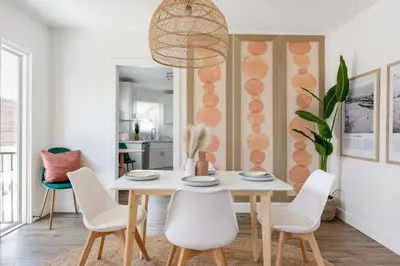 a dining room with a white table and chairs at Sundown Sanctuary in National City in National City