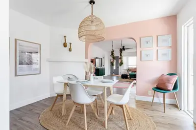 a dining room with a white table and chairs at Sundown Sanctuary in National City in National City