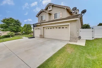 a house with a garage in a yard at Lake Elsinore Vacation Rental about 4 Mi to the Lake! in Lake Elsinore