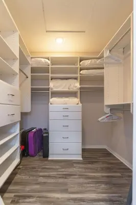 a walk in closet with white drawers and shelves at Sunlit La Jolla Village Gem with Peak Ocean Views in San Diego